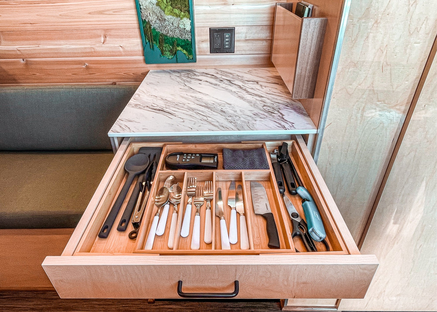  with majestic mountains in the background.|Inside a stylish RV rental: wood walls — photo 10