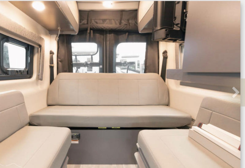  and swivel chairs for travel comfort.|White Thor Tranquility 4x4 Mercedes-Benz Sprinter rv rental showing its rear — photo 7