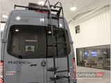 Rear of a grey Winnebago Revel Sprinter RV with roof rack & ladder, excellent for rv rental, shown at a dealership.