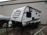 A white Jayco Jay Flight SLX Baja travel trailer, equipped with propane, perfect for an rv rental or camping.