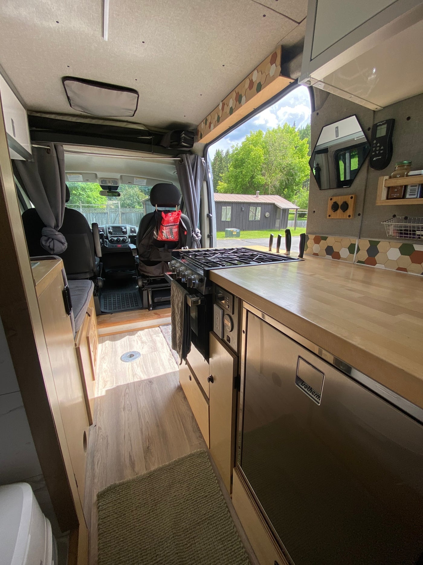  and panoramic window view.|RV rental interior: driver's and passenger's seats — photo 8