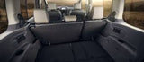 Versatile RV rental interior: large cargo space with folded seats, ideal for travel adventures.