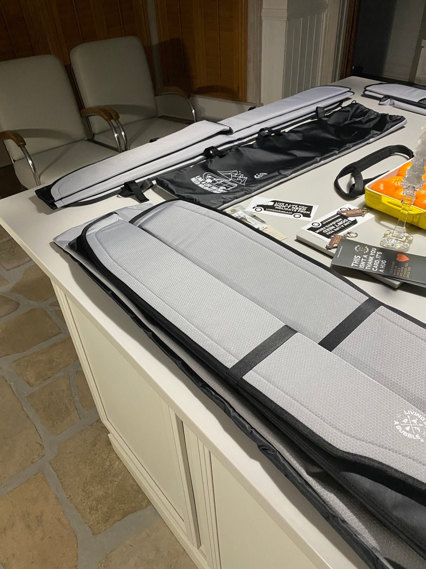 Padded sleeping mats and bags from Living in a Bubble, neatly arranged, perfect gear for your RV rental or camper van.