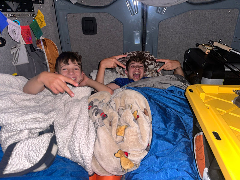 and custom interior for road trip adventures.|View inside an RV rental showing organized overhead storage — photo 15