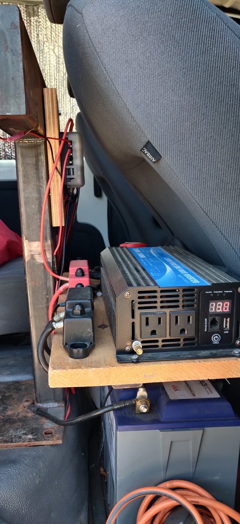 An inverter and battery setup provides off-grid power inside an RV rental or camper van. — photo 12