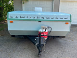 Light blue pop-up camper, text reads "Into the forest I go to love my mind and find my soul." Perfect RV rental for nature trips.