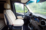 Experience luxury in this RV rental's spacious front cabin. Cream quilted seats, modern dash & scenic view for comfortable travels.