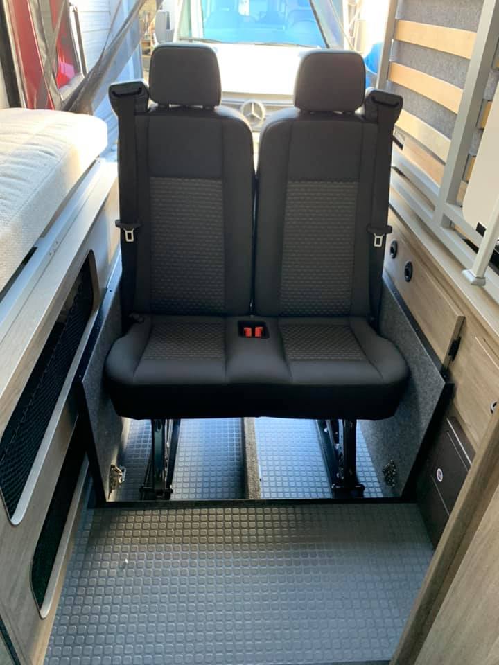  designed for practical travel.|Explore this RV rental's inviting interior: dinette with a game & drinks — photo 12