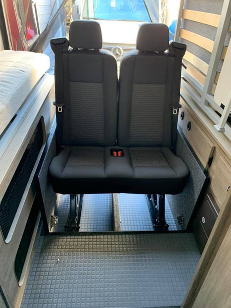 RV rental ready: Camper van interior with versatile 2-person passenger seating on floor tracks, ensuring travel safety.