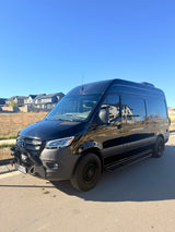 Black, customized Mercedes-Benz Sprinter van, perfect for your next rv rental adventure or road trip.