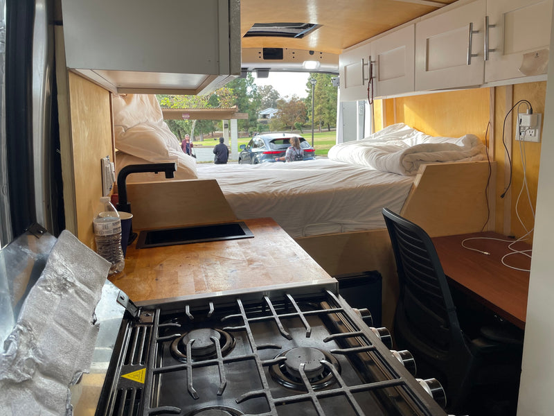  and park views out the back.|Spacious RV rental interior with a cozy bed — photo 11