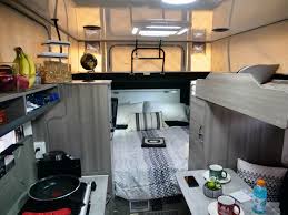  ready for adventure.|Bright RV rental interior with a gray dinette area — photo 7