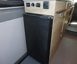 This RV rental features a built-in refrigerator and control panel with outlets, maximizing space for your adventures.