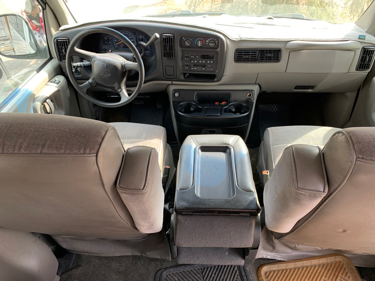 Interior of an RV rental showing the dashboard, steering wheel, and front seats. Ideal for road trips. — photo 7