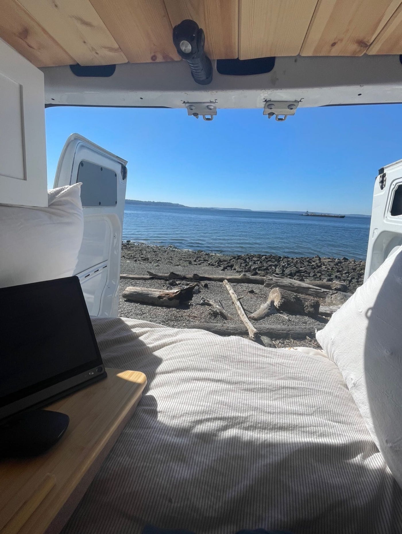  and practical storage.|Inside an RV rental: a comfy bed — photo 14