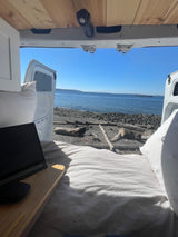 RV rental: Van life with a coastal view. Enjoy the ocean from your cozy bed.