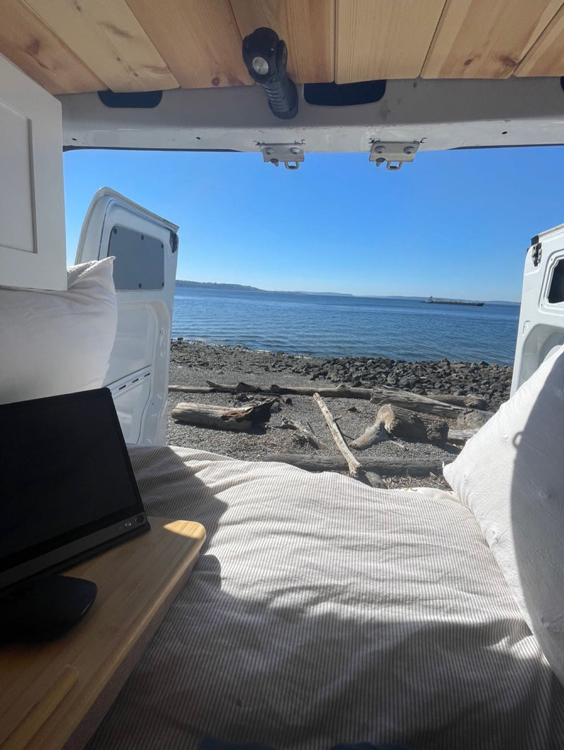  and practical storage.|Inside an RV rental: a comfy bed — photo 14