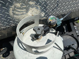 A gray propane tank for an RV rental, equipped with a gas level gauge, ready for outdoor adventures.