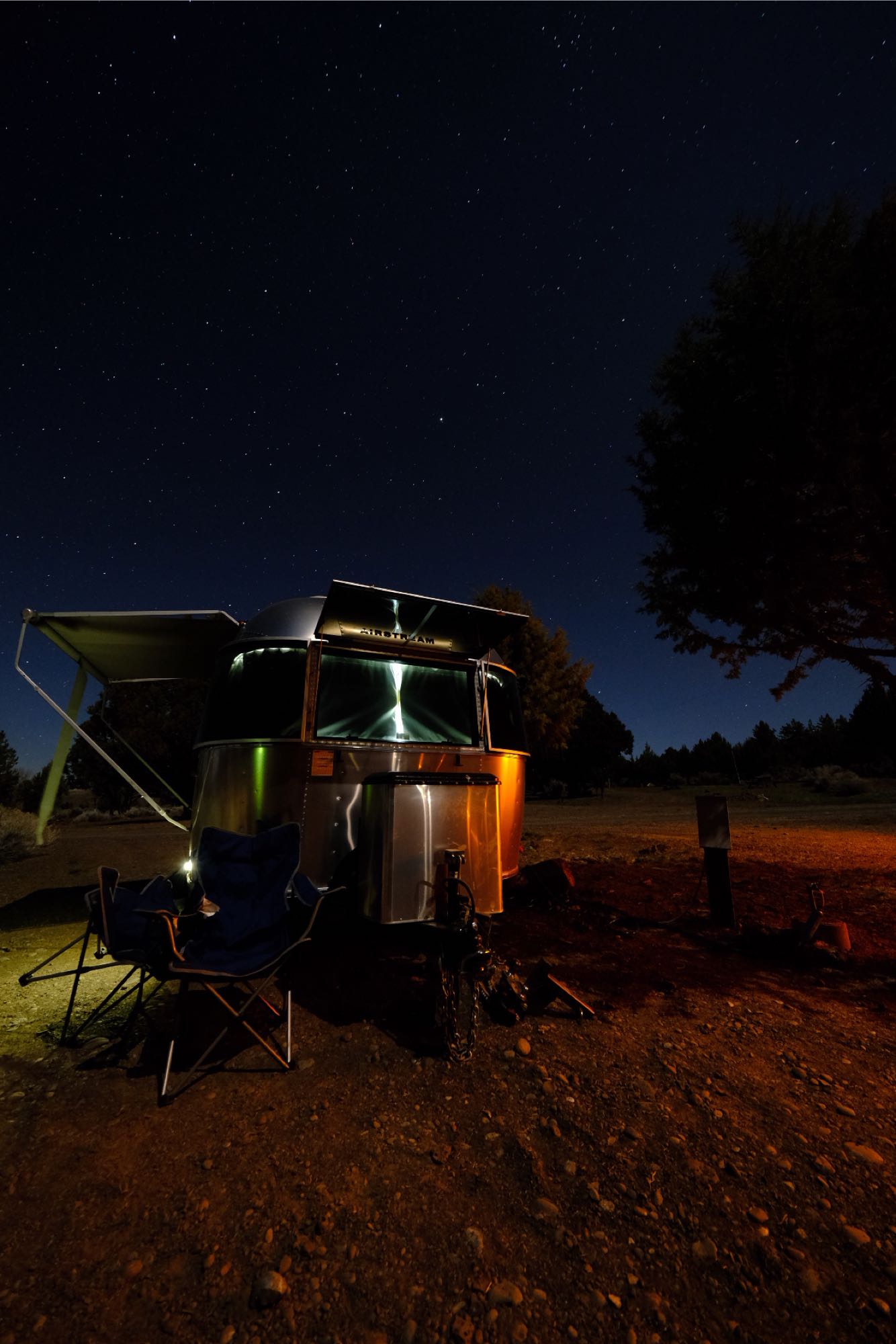  star-filled night sky.|Explore this compact RV rental's interior floor plan: bed