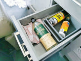 Stay organized in your rv rental! This drawer holds Ever Spring dish soap, a towel, and Armor All Tire Foam.