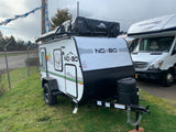Adventure-ready NO BO travel trailer with rooftop tent, ideal for your next RV rental camping trip.