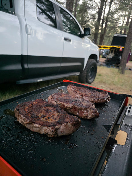  and Yeti mugs.|This RV rental features an outdoor kitchen with a two-burner stove