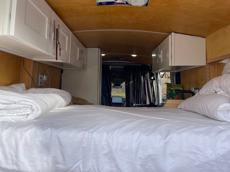  perfect for mobile living.|Cozy RV rental interior featuring a kitchen with a stove/sink — photo 14