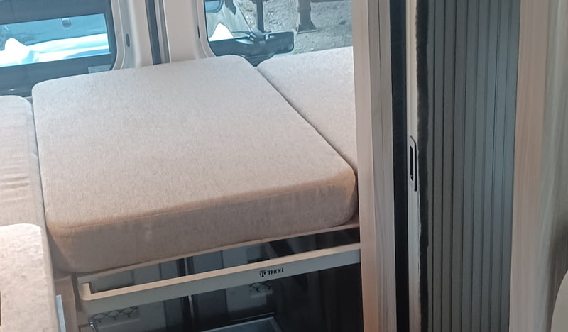  and front swivel chairs.|This silver "SCOPE" camper van is an ideal RV rental — photo 9