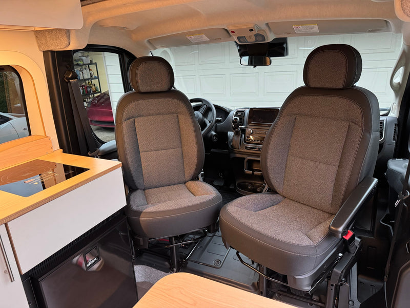  and comfortable seats. Ideal for road trips!|This modern RV rental interior showcases a fully equipped kitchenette with a sink — photo 2