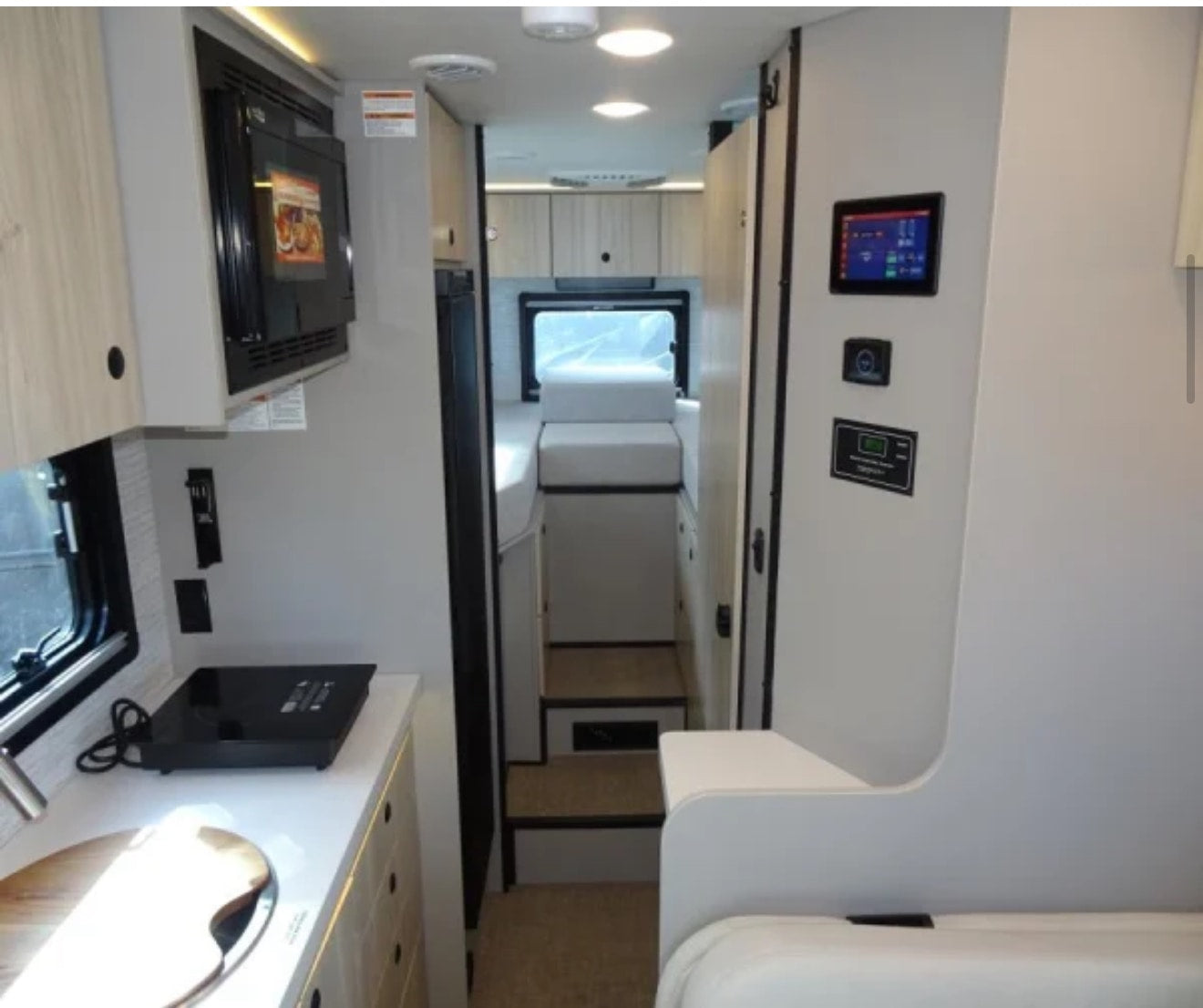  and front seats.|Inside an RV rental: dining table — photo 8