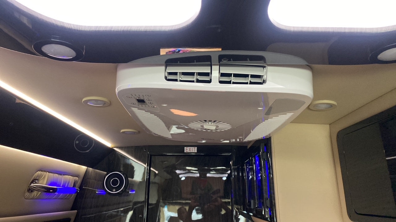 Luxury RV rental interior: overhead AC, LED lighting & premium finishes ensure comfortable travel.