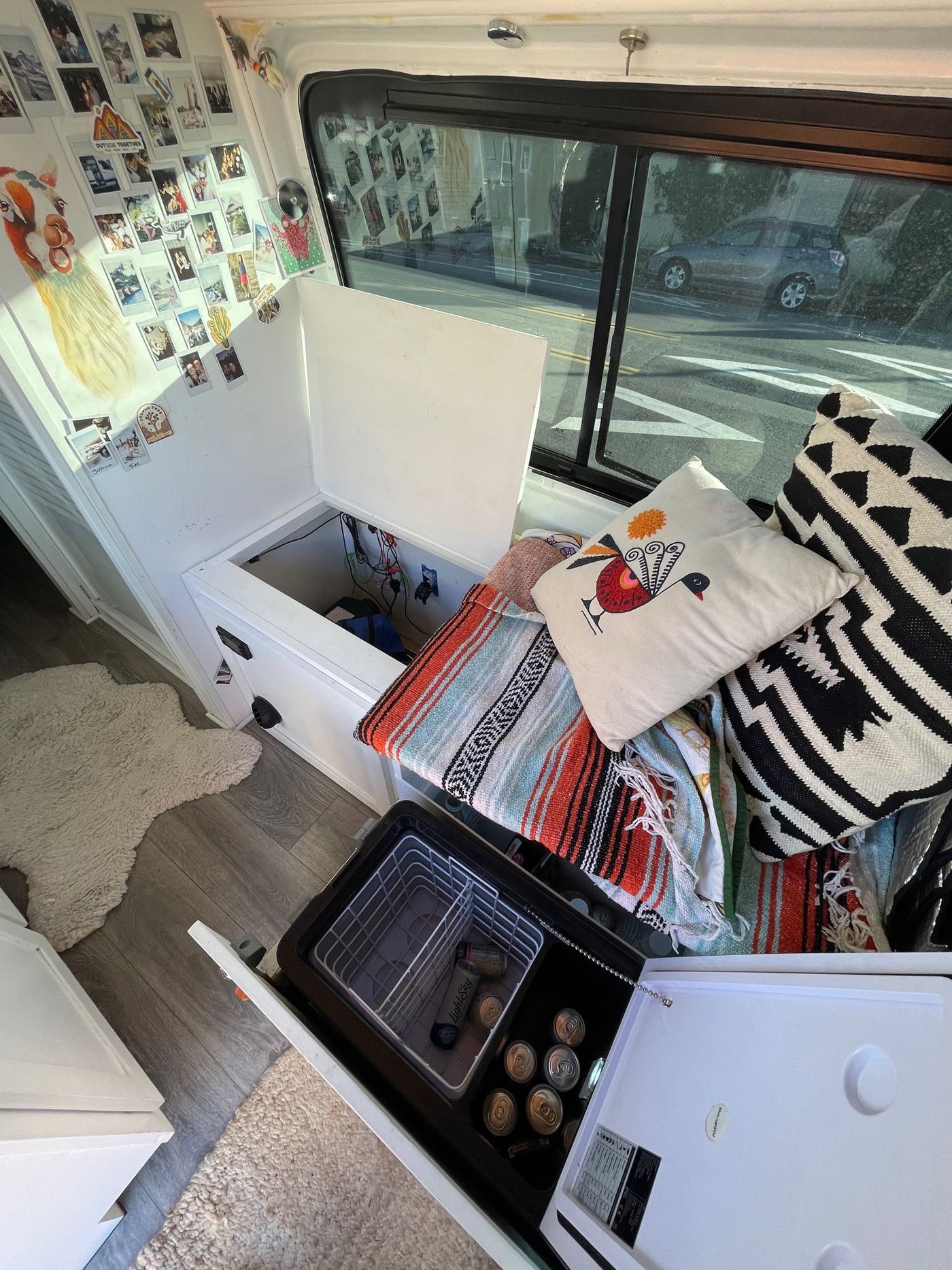  and cozy custom decor for your adventure.|Cozy RV rental camper van interior. Features custom wood ceiling — photo 9