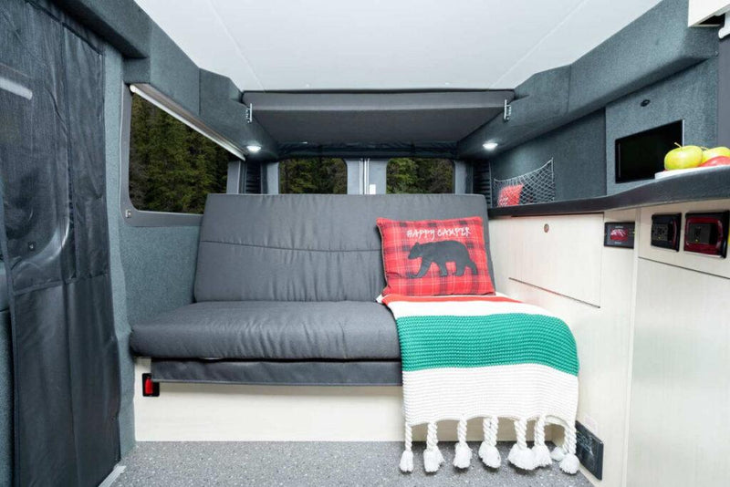  and seating.|Modern rv rental interior: compact kitchen with sink — photo 6