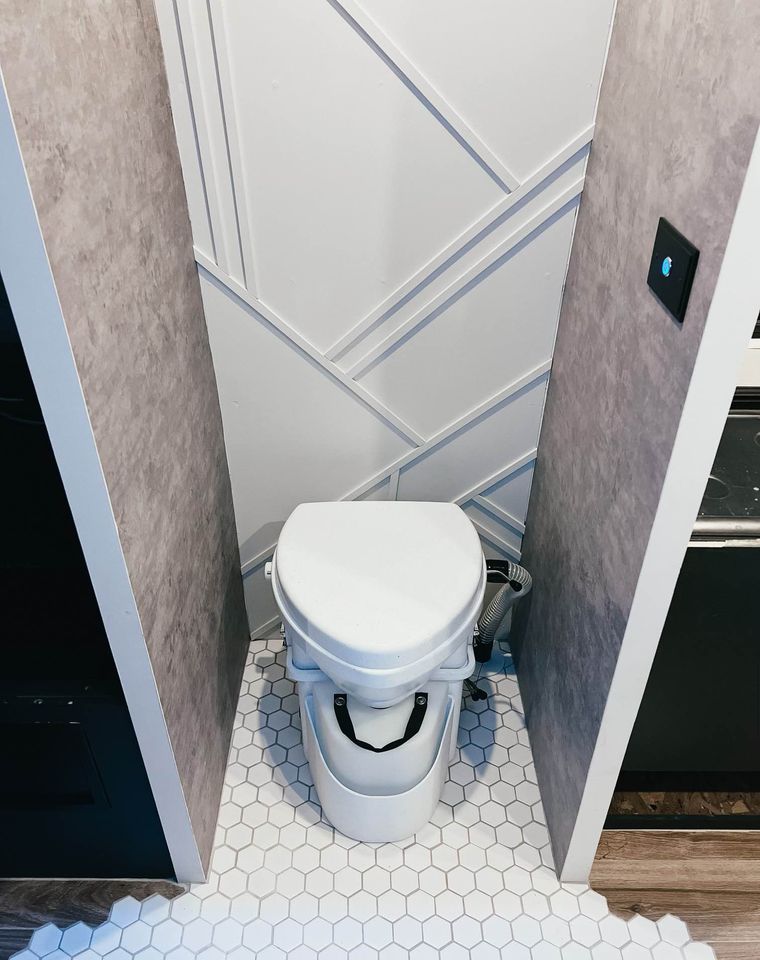 and power outlets.|RV rental's versatile interior: features a fold-down seat — photo 8