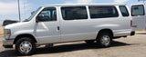 White Ford E-350 passenger van for rv rental or large group travel, parked outdoors with rear door open.