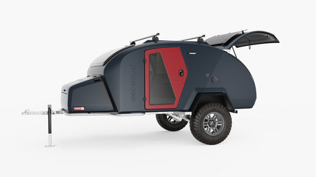 Dark blue Escapod TOPO 2 teardrop camper trailer with red door, solar panels, and off-road tires, great for RV rental.
