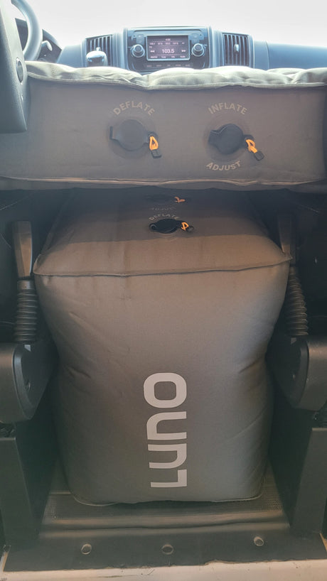 Luno air mattress setup in an RV rental, creating a comfortable bed with visible inflate/deflate controls.