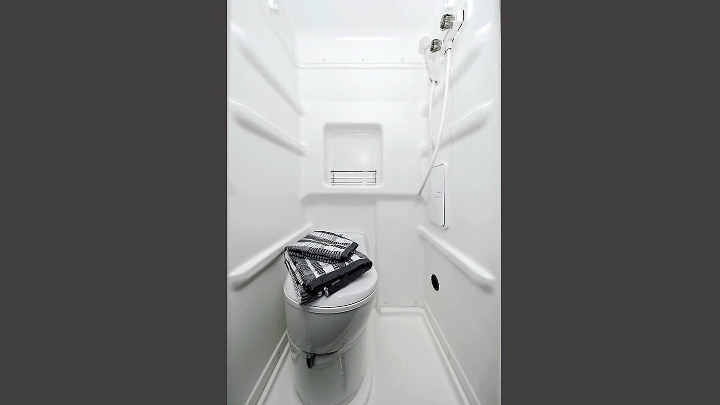  a lamp & plush bear.|Interior of an RV rental: comfortable seating — photo 4