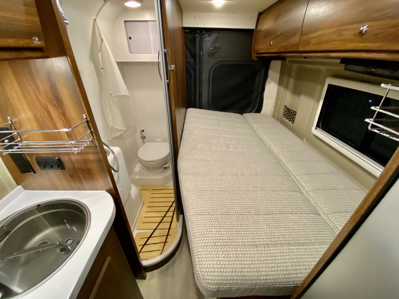  perfect for comfortable road trips.|Spacious RV rental interior with white leather seating — photo 3