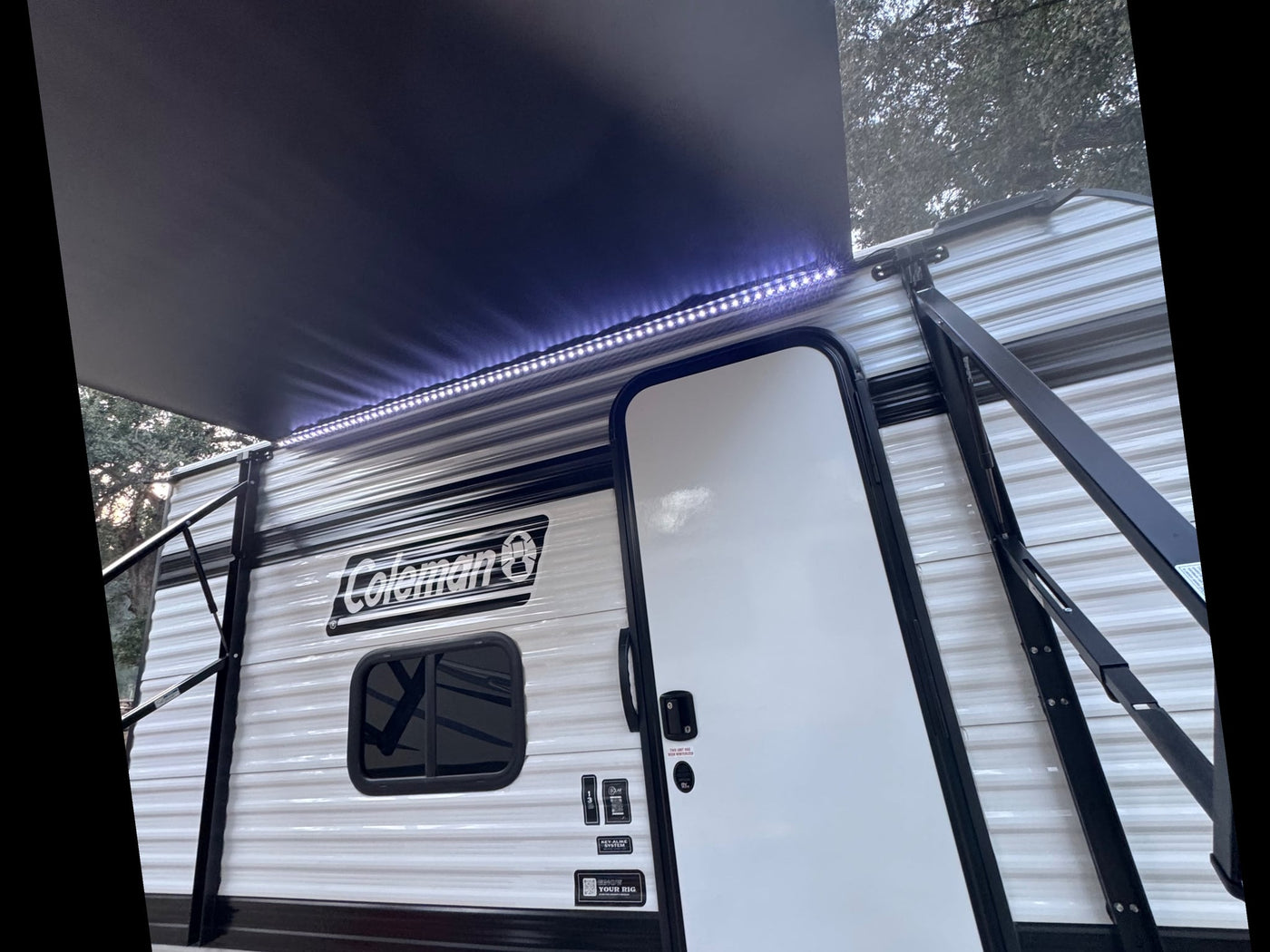  and cozy amenities.|White Toyota Tacoma towing a Coleman RV rental — photo 8