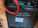 Essential for an rv rental, this 200Ah LiFePO4 lithium battery provides reliable off-grid power inside a wooden enclosure.