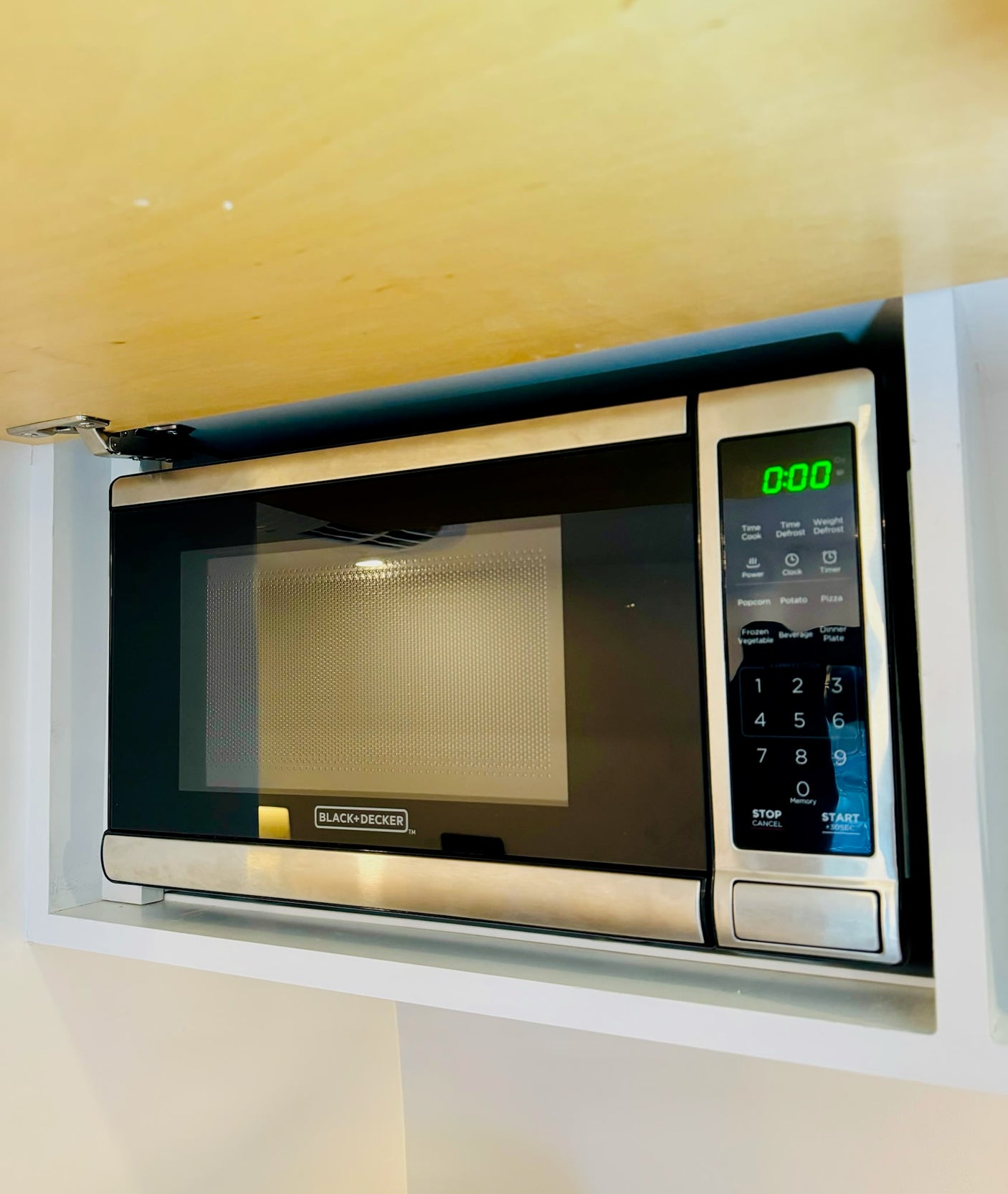 Built-in Black+Decker microwave, a convenient kitchen appliance found in an RV rental kitchen setup.