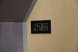 RV rental interior featuring a digital display showing temperature (42) and humidity (73.4%), ensuring climate comfort.