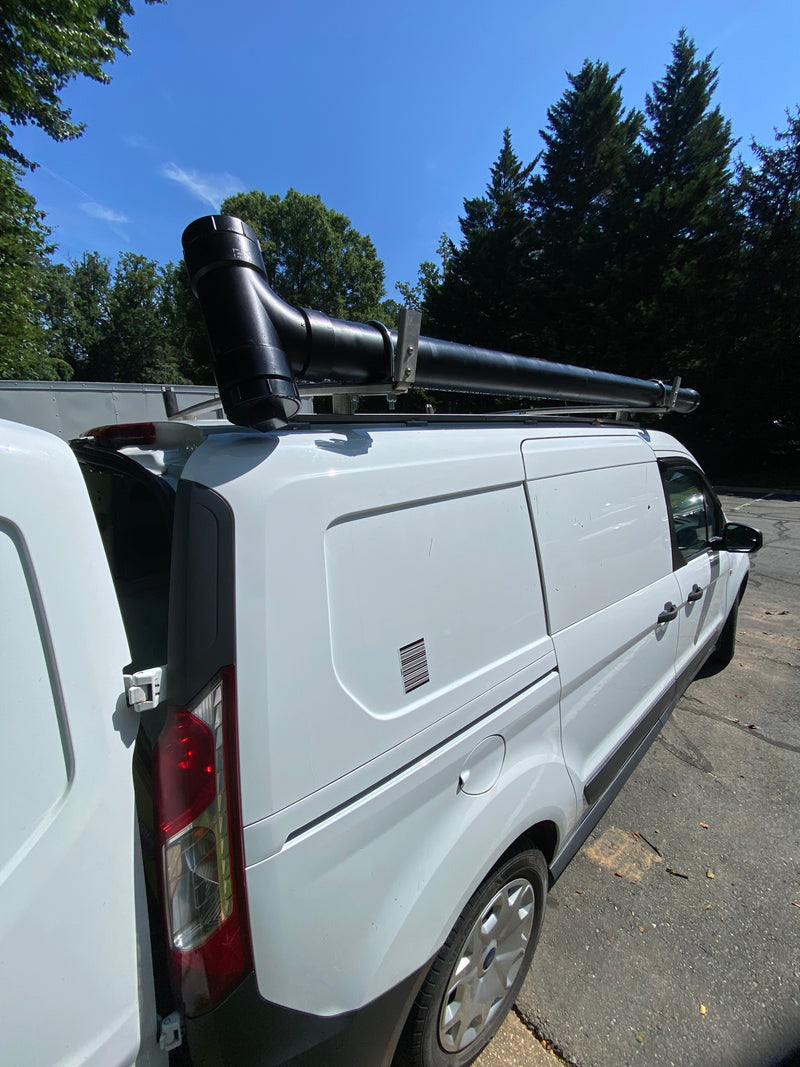 White utility van with a long pipe mounted on its roof rack, rear door open. Ideal for work or support for an **RV rental** trip. — photo 9