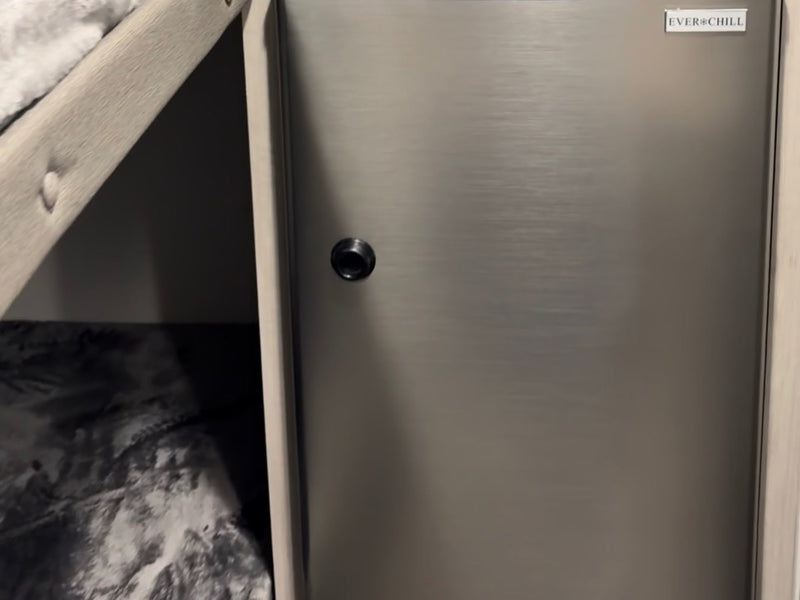  and patterned bed.|Inside an RV rental: a modern kitchen area with a sleek gas stove — photo 9