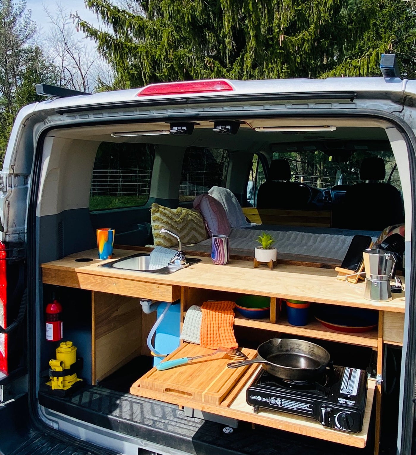  parked in a grassy field under a cloudy sky.|Step inside this RV rental — photo 6