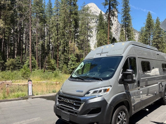  ready for nature travel.|A grey rv rental camper van is parked on a sunny day in Yosemite — photo 4
