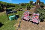 Enjoy outdoor living with your rv rental! Portable stove, cooler, & beach chairs for a perfect picnic setup.