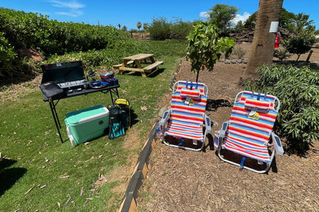 Enjoy outdoor living with your rv rental! Portable stove, cooler, & beach chairs for a perfect picnic setup.