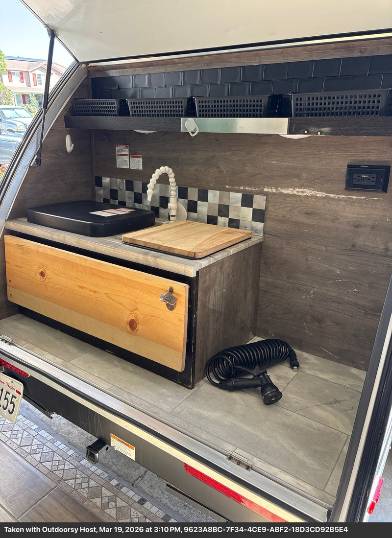  and built-in amenities.|Modern RV rental sleeping area with convenient amenities: bed — photo 4